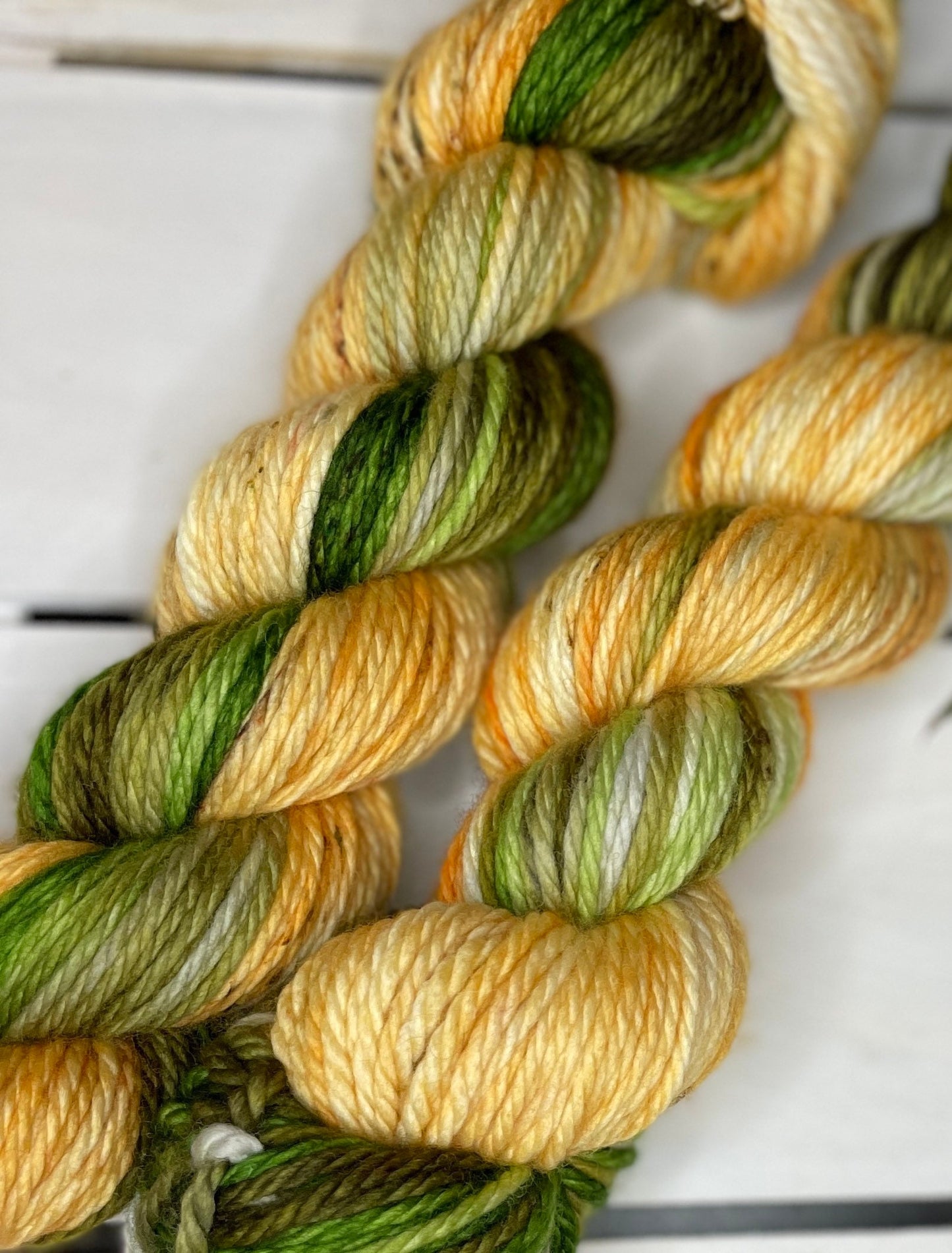 Mountain Meadows, bulky green and golden 100%superwash merino handdyed wool