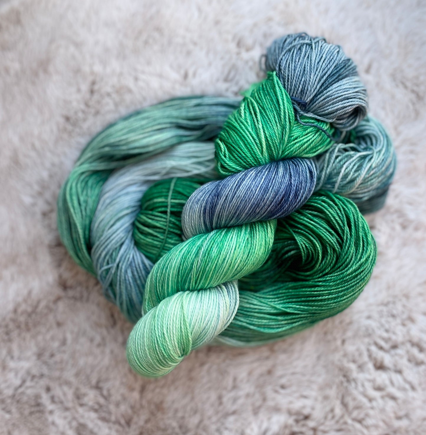 Deep Sea on fingering 100% superwash merino wool, green blue