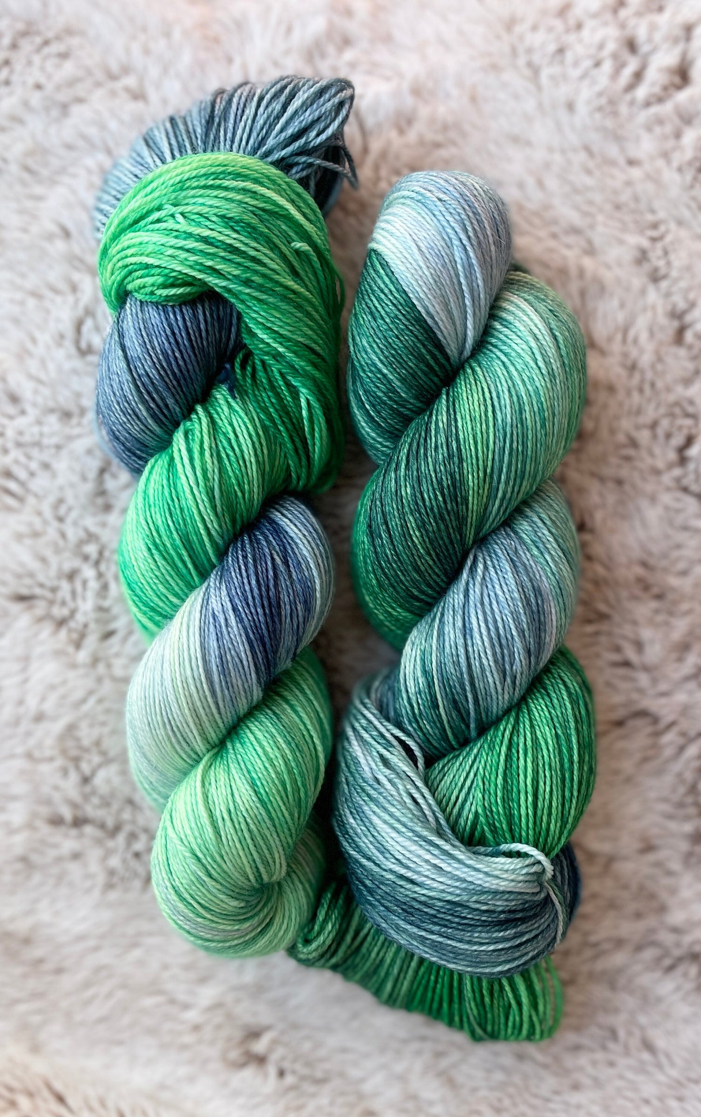 Deep Sea on fingering 100% superwash merino wool, green blue